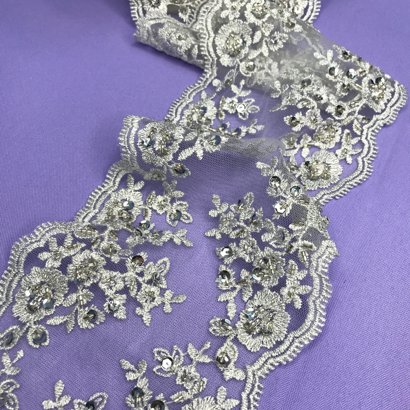 Double Sided Beaded Silver Trimming, Embroidered on 100 % Polyester Net Mesh.  Sold by the Yard.  Lace Usa