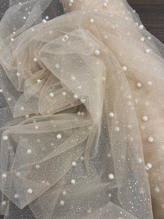 Glitter Mesh Net With Scattered Pearl , 2-Way Stretch, sold by the yard. 100% Polyester 60" wide. This mesh fabric is a 2-way stretch on the width. Pearls are scattered across the mesh.  Sold by the yard, 1-quantity equals to 1-yard.  If you order more than 1-yard, it will be ship in one continuous length.    Lace Usa
