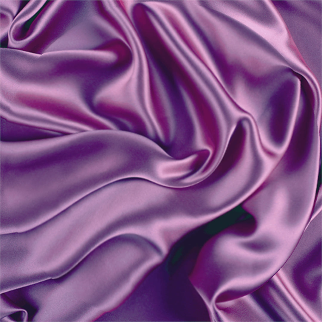 A draped piece of purple Charmeuse Medium Satin Lining Fabric . 100% Polyestermaterial