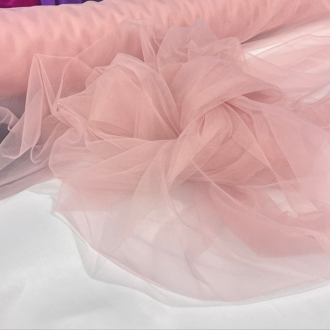 Close-up of Blush color tulle fabric on a white surface  - Lace USA W6560
