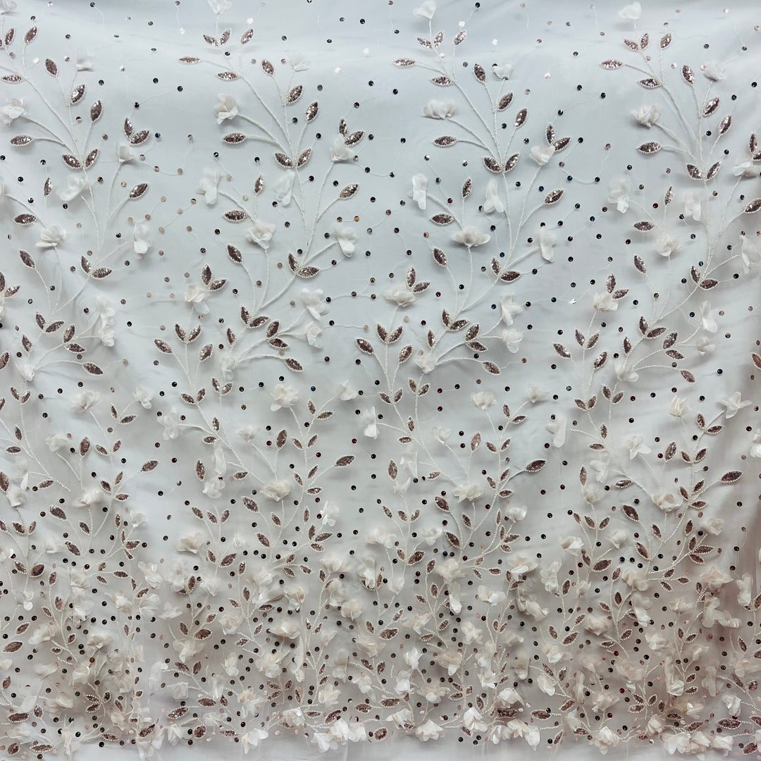 White floral embroidered lace fabric with blush leaf accents and beading