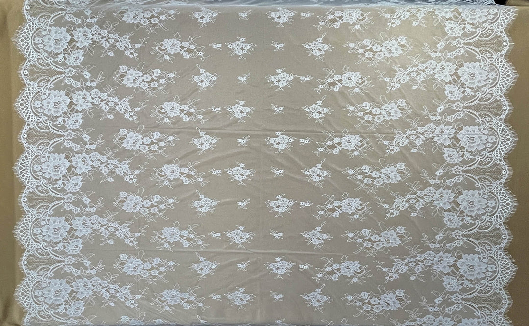 Ivory/Off White Chantilly lace fabric with floral patterns on a brown background - LaceUSA-GDF-11