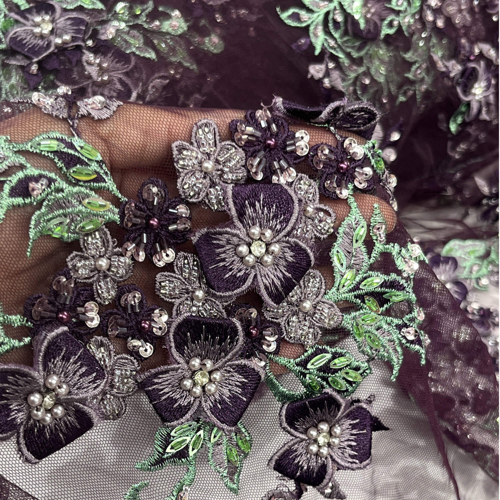 Close-up of Lace USA GD-3040 3D floral lace with mint and eggplant embroidery, embellished with beads and rhinestones—ideal for formalwear