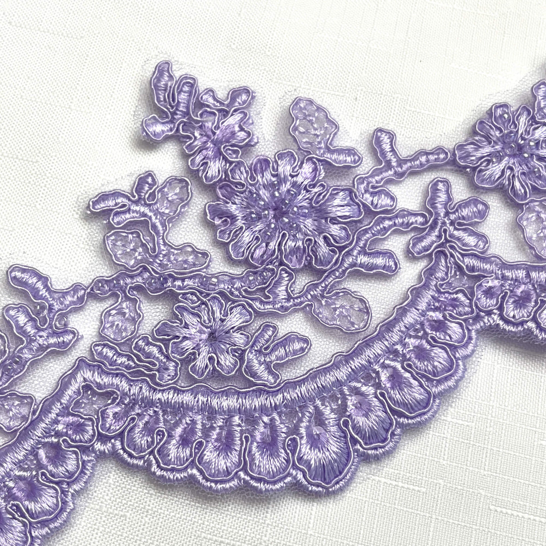Close-up of lilac floral scalloped lace trim with beads and corded embroidery on net mesh – LaceUSA 96215WHB  