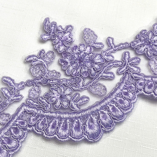 Close-up of lilac floral scalloped lace trim with beads and corded embroidery on net mesh – LaceUSA 96215WHB  
