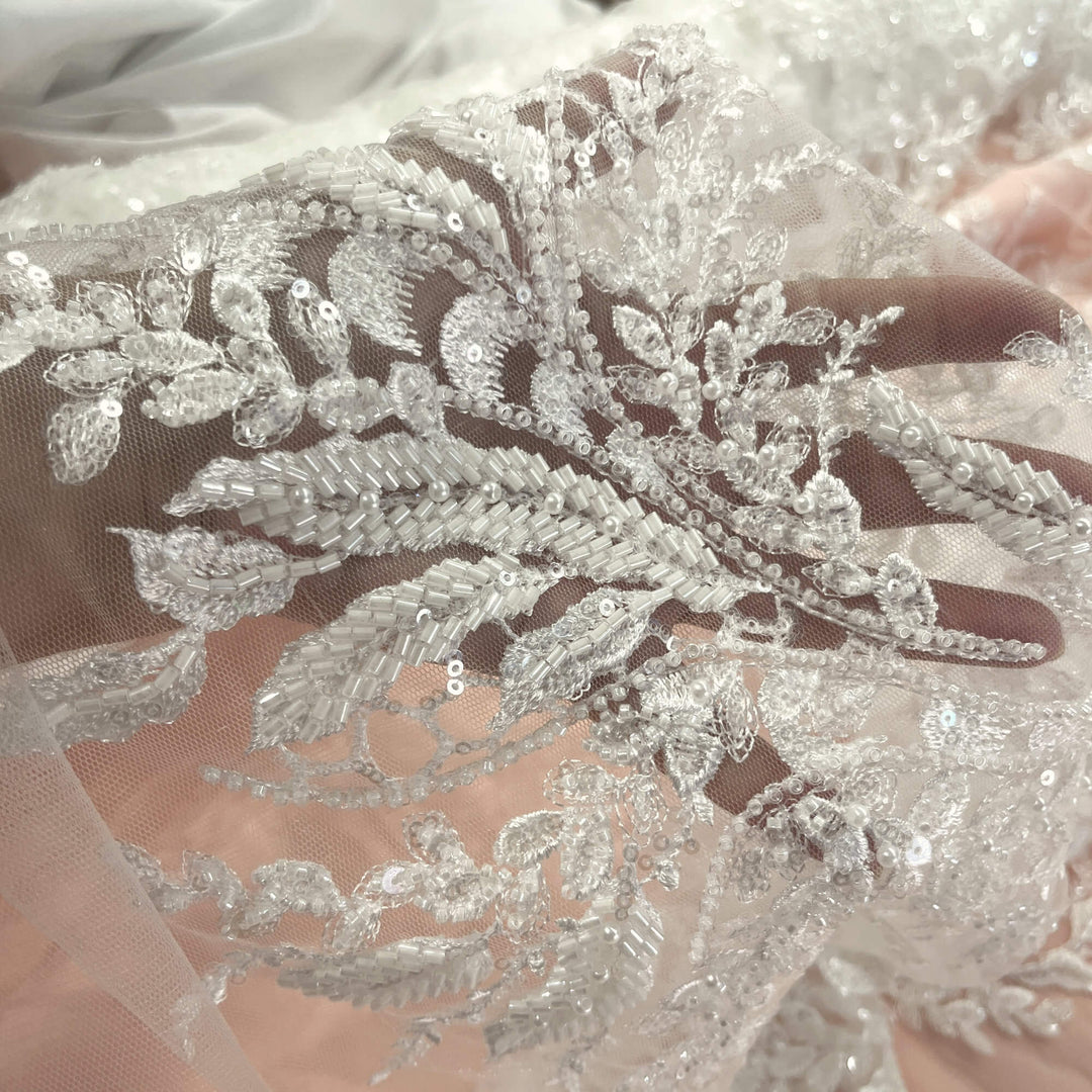 Close up of Beaded Off White lace fabric with embroidered leaf design, sequins, and beads – ideal for Bridal gowns and Dance Costumes -LaceUSA GD12695