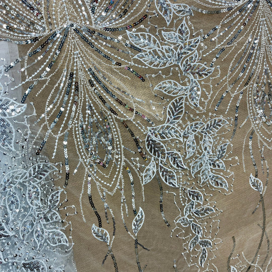 Closup look at Silver beaded and sequined lace fabric with leaf and vine embroidery – ideal for bridal, quinceañera, and evening gowns.| Lace USA - GD-2918