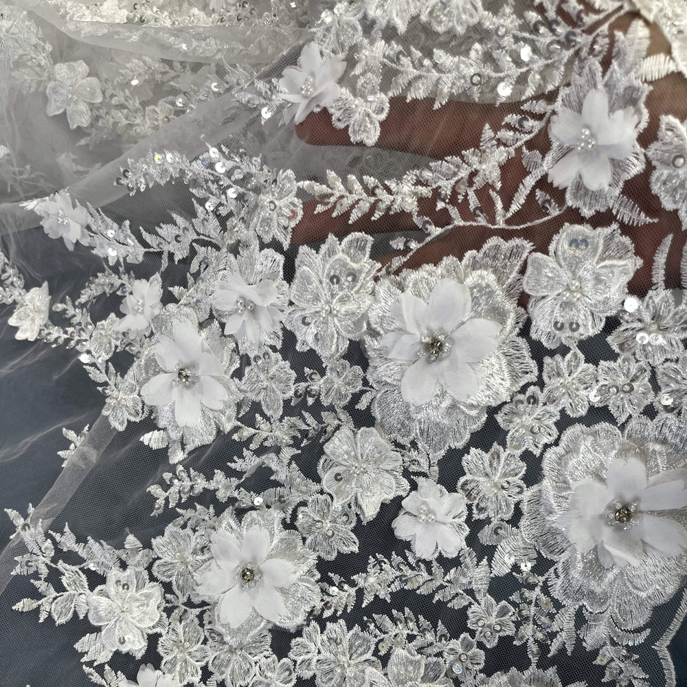 Closeup of white 3D embroidered floral lace fabric, embellished with beads and rhinestones – LaceUSA GD2880