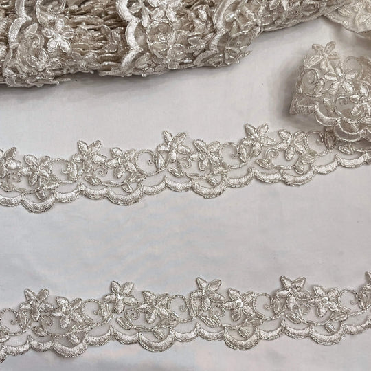 Closeup of Beaded Ivory with Silver  Cording Lace Trimming Embroidered on 100% Polyester Net Mesh | Lace USA - 97012W-BP