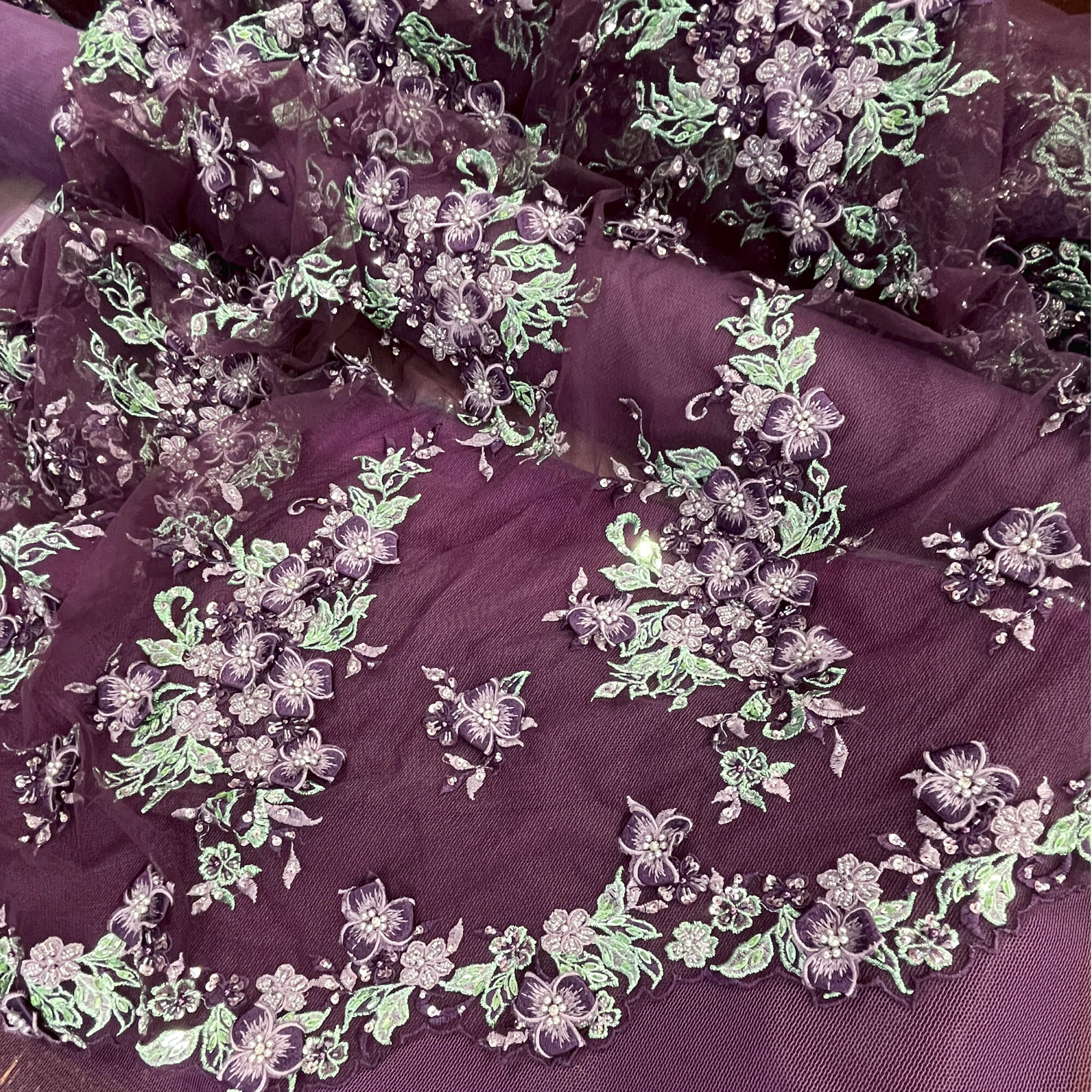 Mid view of Lace USA GD-3040 beaded 3D floral lace with mint and eggplant embroidery on mesh—ideal for gowns and formalwear