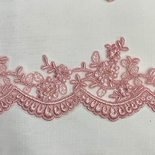 Closeup of Pink beaded corded floral scalloped lace embroidered on polyester net mesh - LaceUSA 96215WHB