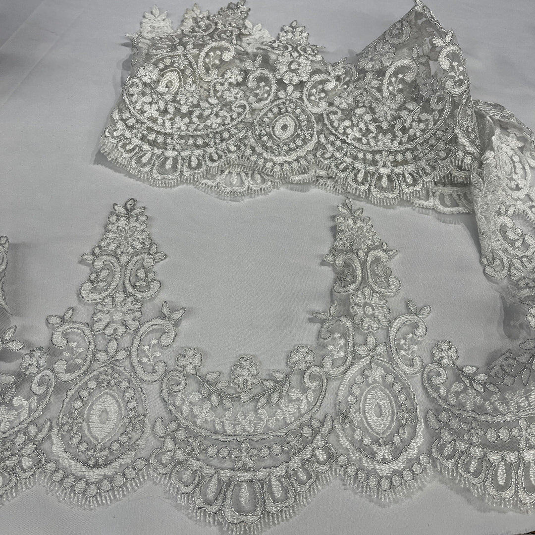 White with silver cording floral lace trim with ornate embroidery and scalloped edging, displayed on a white background.  Lace USA 96794W 
