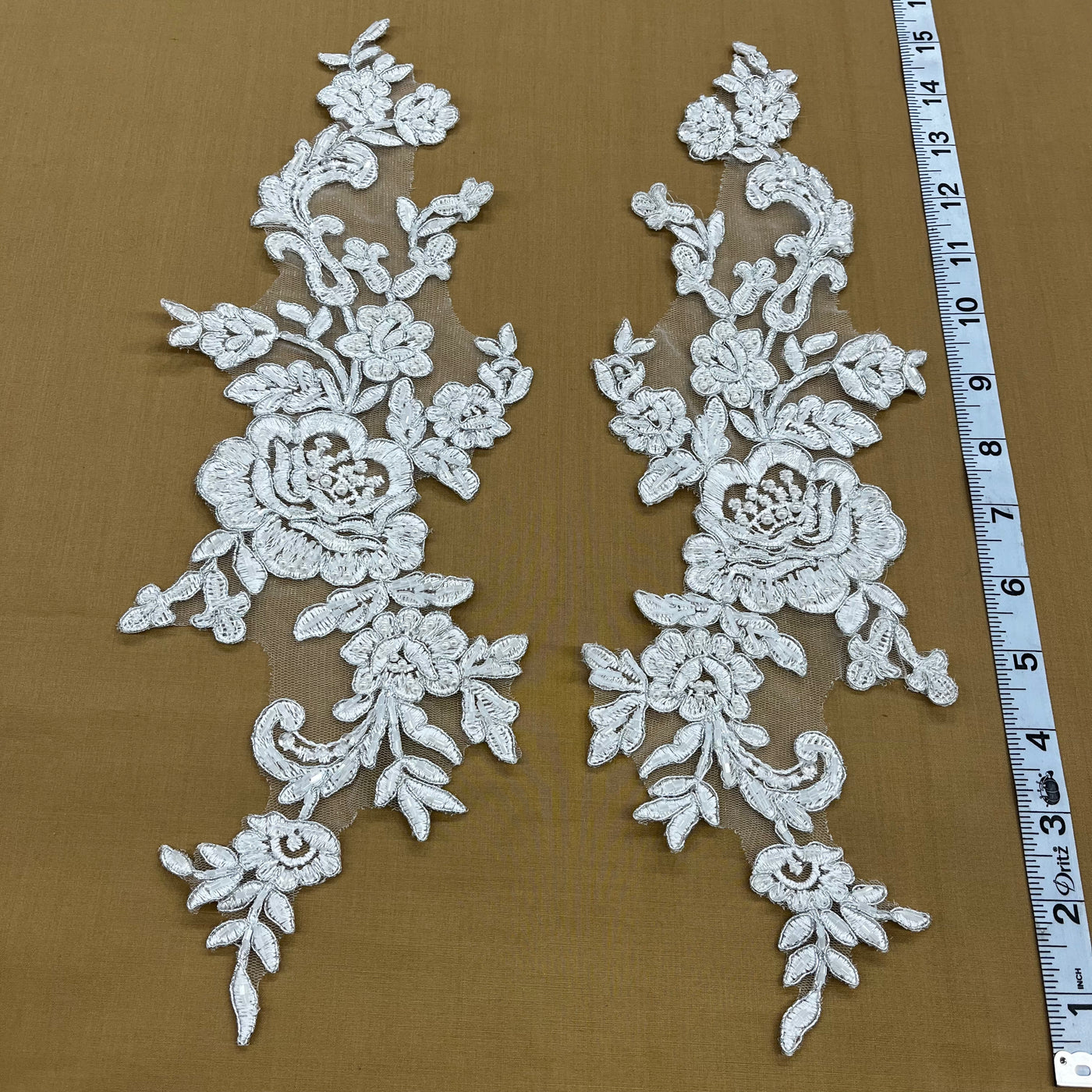 Beaded & Corded Floral Appliqué Lace Embroidered on 100% Polyester Organza or Net Mesh. This can be applied to Theatrical dance ballroom costumes, bridal dresses, bridal headbands endless possibilities. Sold By Pair Lace Usa