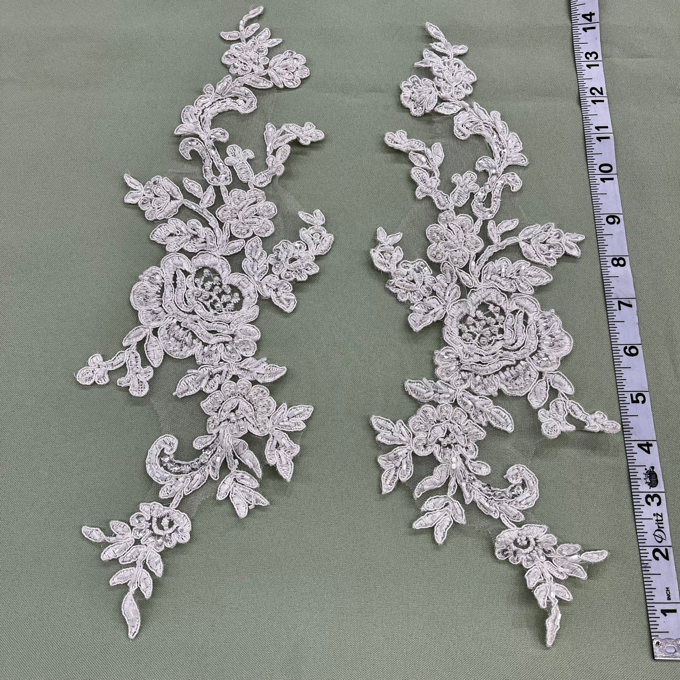 Beaded & Corded Floral Appliqué Lace Embroidered on 100% Polyester Organza or Net Mesh. This can be applied to Theatrical dance ballroom costumes, bridal dresses, bridal headbands endless possibilities. Sold By Pair Lace Usa