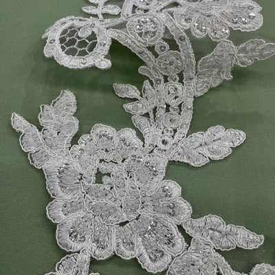 Beaded & Corded Floral Appliqué Lace Embroidered on 100% Polyester Organza or Net Mesh. This can be applied to Theatrical dance ballroom costumes, bridal dresses, bridal headbands endless possibilities. Sold By Pair Lace Usa