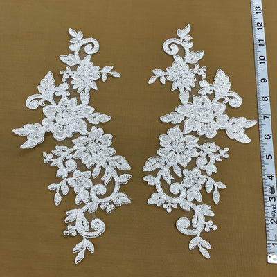 Beaded & Corded Silver Floral Appliqué Lace Embroidered on 100% Polyester Organza or Net Mesh. This can be applied to Theatrical dance ballroom costumes, bridal dresses, bridal headbands endless possibilities. Sold By Pair. Lace Usa