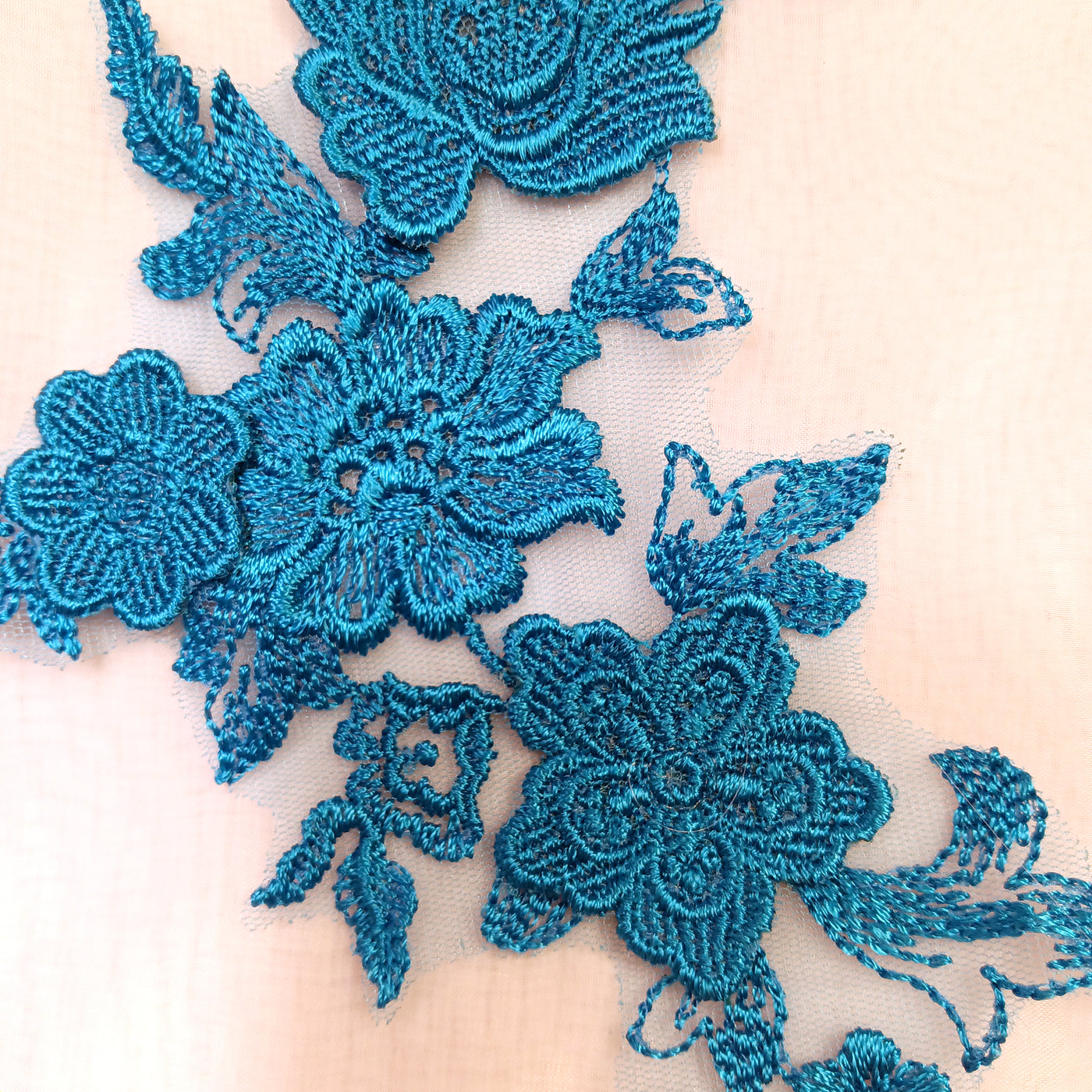 Embroidered Turquoise Applique with 3D Flowers on 100% Polyester Net Mesh.