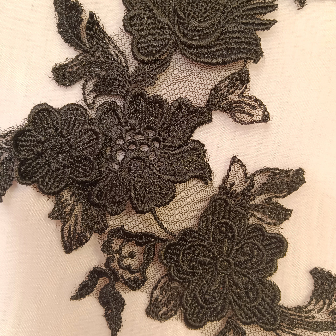 Embroidered Black Applique with 3D Flowers on 100% Polyester Net Mesh.