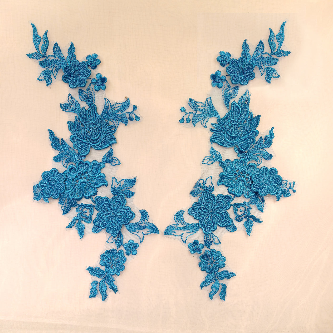 Embroidered Turquoise Applique with 3D Flowers on 100% Polyester Net Mesh.  Sold by the pair.  Lace Usa