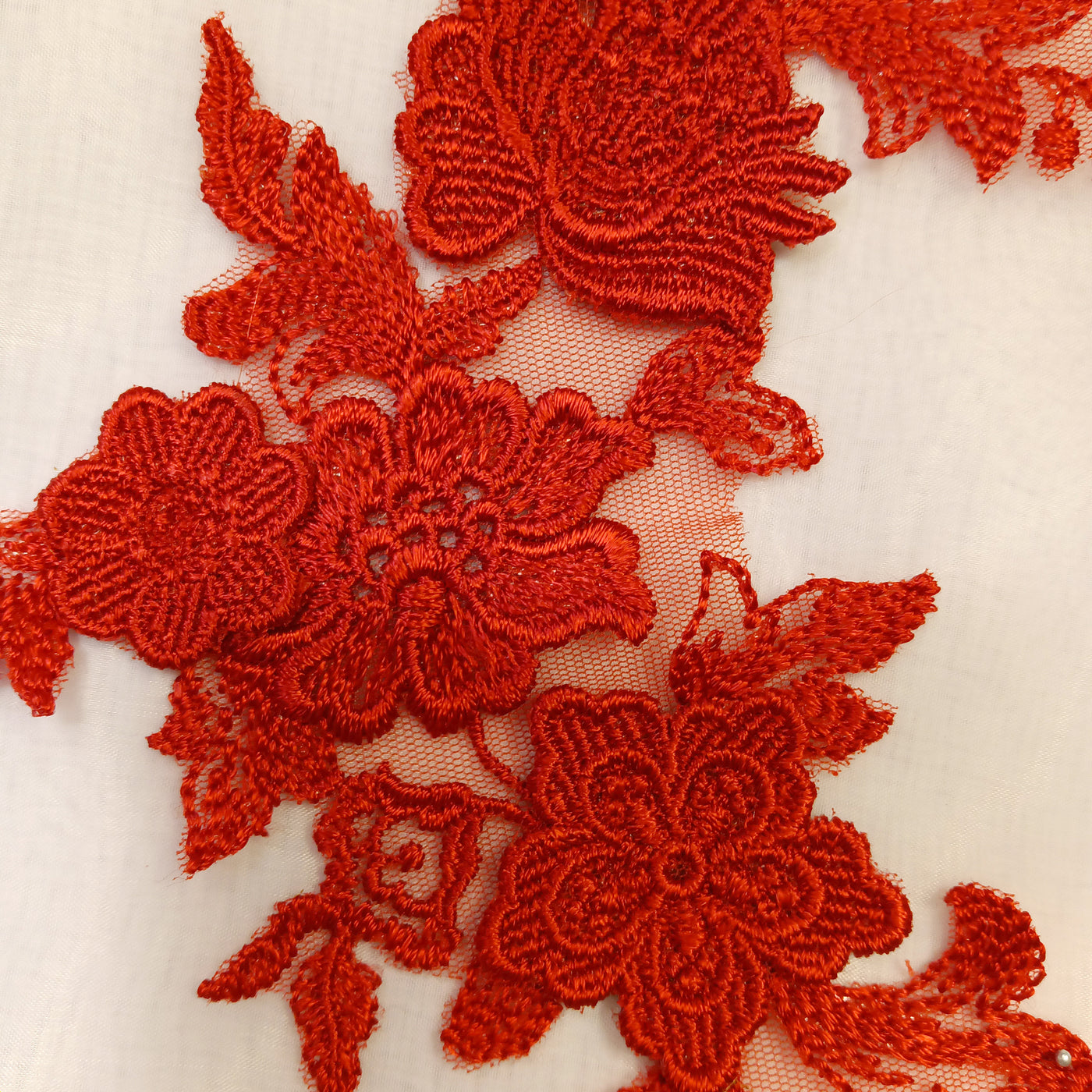 Embroidered Red Applique with 3D Flowers on 100% Polyester Net Mesh.