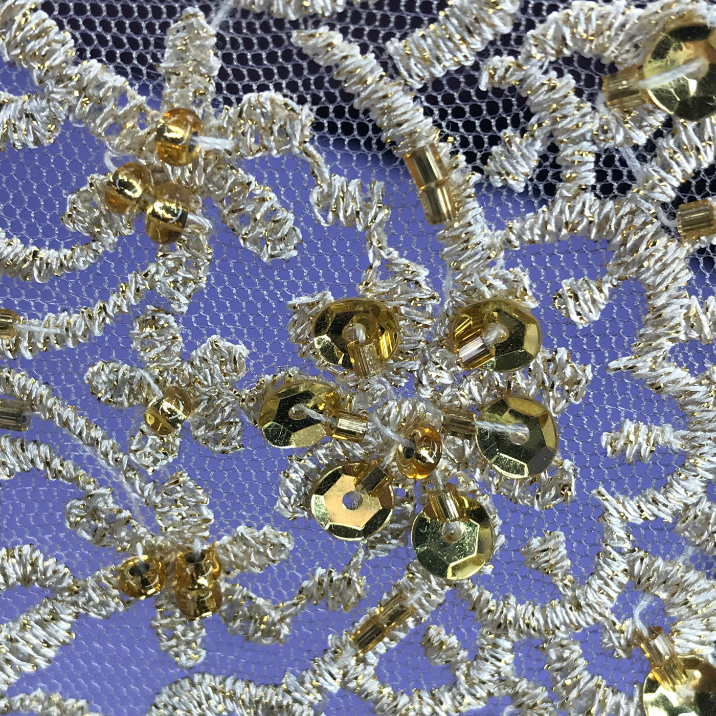 Double Sided Beaded Gold Trimming, Embroidered on 100 % Polyester Net Mesh.  Sold by the Yard.  Lace Usa