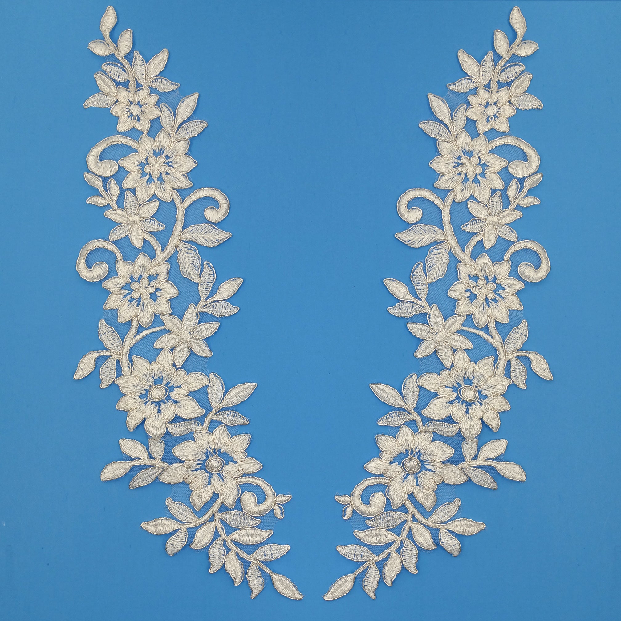 Ivory with Silver Floral Applique Embroidered on 100% Polyester Mesh Net. Lace Usa
