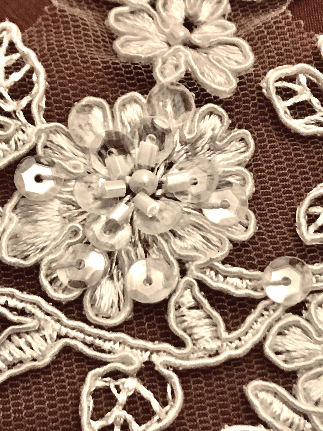Closeup of beading on ivory corded floral lace trim embroidered on net mesh | Lace USA 96215WBP
