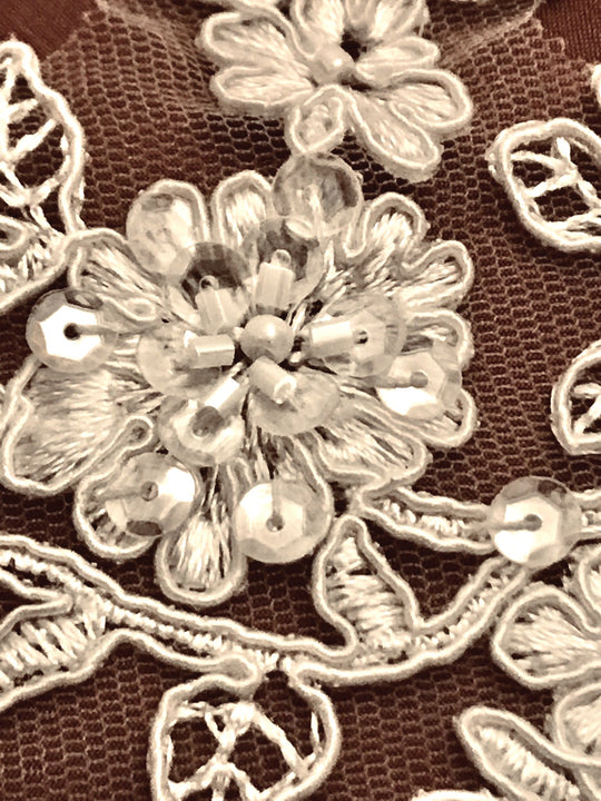 Closeup of beading on ivory corded floral lace trim embroidered on net mesh | Lace USA 96215WBP