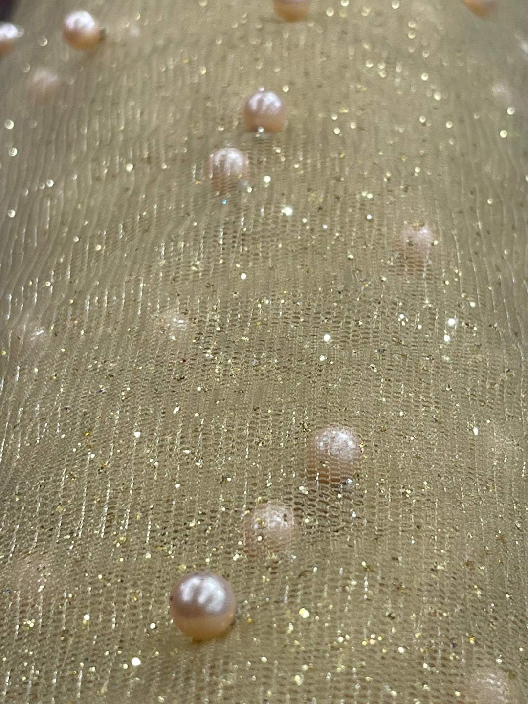 Glitter Mesh Net With Scattered Pearl , 2-Way Stretch, sold by the yard. 100% Polyester 60" wide. This mesh fabric is a 2-way stretch on the width. Pearls are scattered across the mesh.  Sold by the yard, 1-quantity equals to 1-yard.  If you order more than 1-yard, it will be ship in one continuous length.    Lace Usa