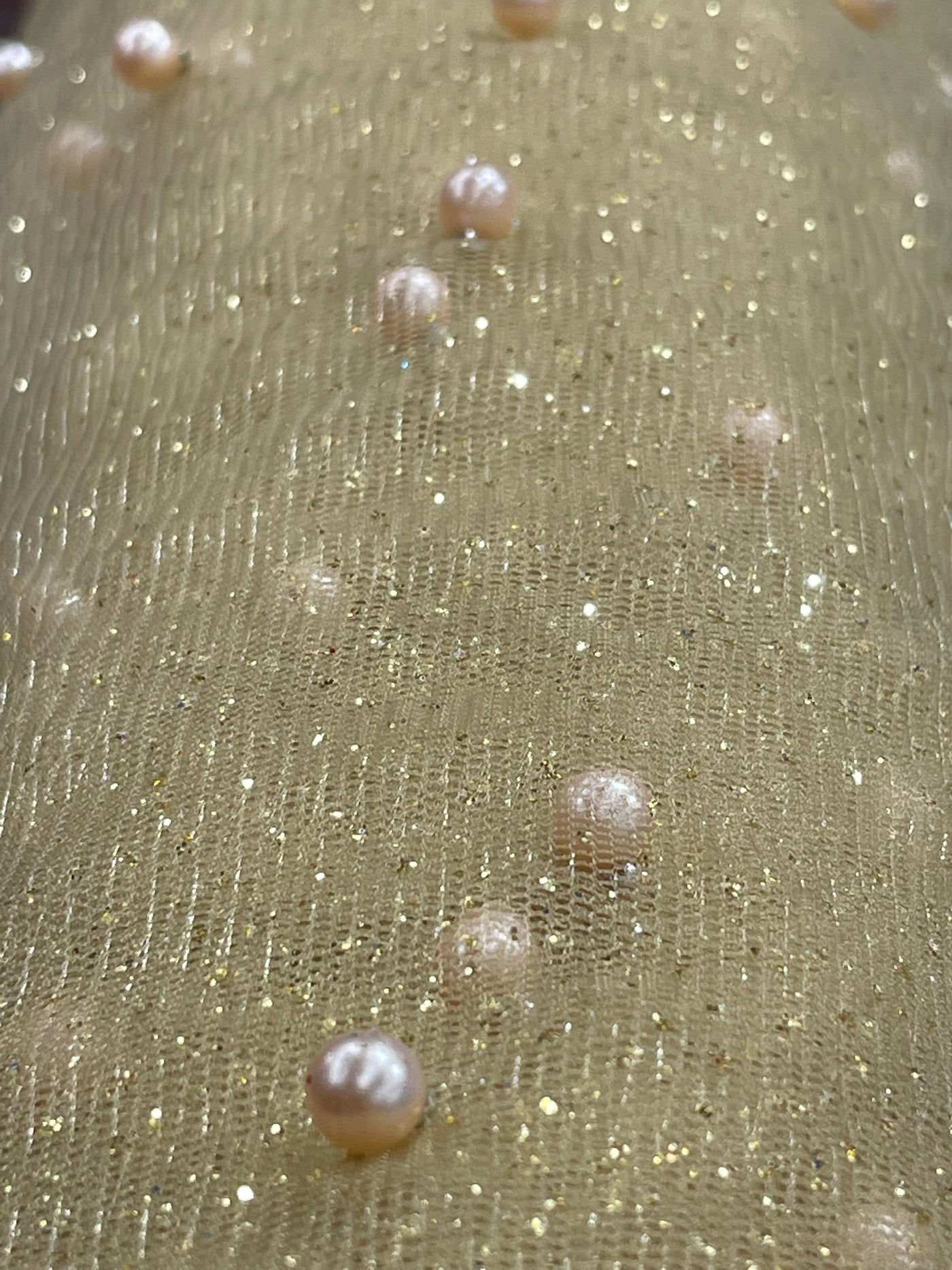 Glitter Mesh Net With Scattered Pearl , 2-Way Stretch, sold by the yard. 100% Polyester 60" wide. This mesh fabric is a 2-way stretch on the width. Pearls are scattered across the mesh.  Sold by the yard, 1-quantity equals to 1-yard.  If you order more than 1-yard, it will be ship in one continuous length.    Lace Usa