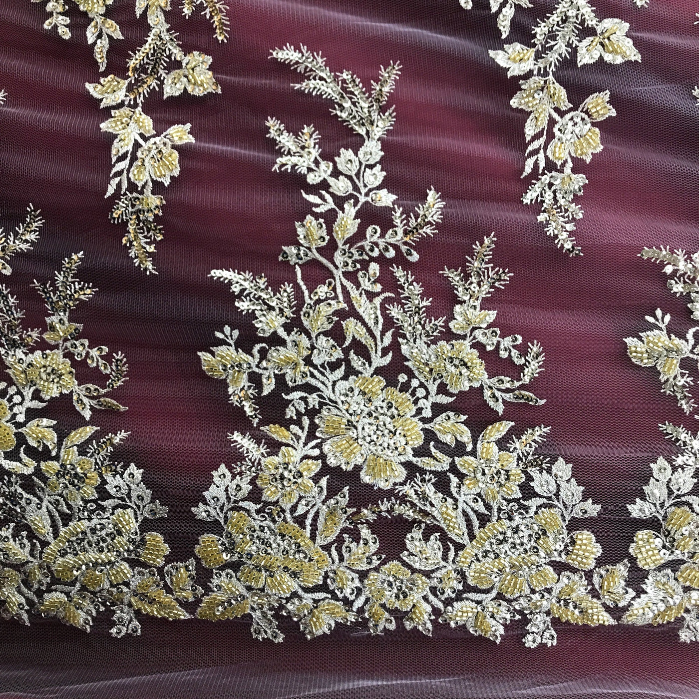 Embroidered & Heavily Beaded Fabric on net.  Sold by the yard.  Lace Usa