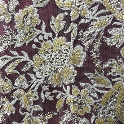 Embroidered & Heavily Beaded Fabric on net.  Sold by the yard.  Lace Usa