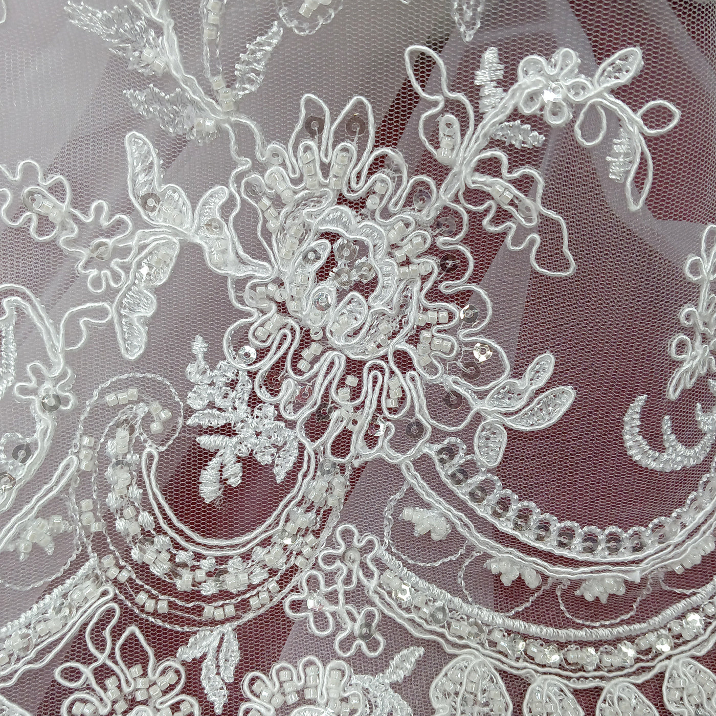 Corded & Beaded Bridal Lace Fabric Embroidered on 100% Polyester Net Mesh.  Sold the yard.  Lace Usa