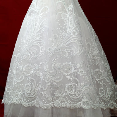 Corded & Beaded Bridal Lace Fabric Embroidered on 100% Polyester Net Mesh.  Sold the yard.  Lace Usa