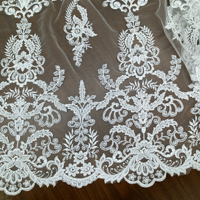 Corded & Beaded Bridal Lace Fabric Embroidered on 100% Polyester Net Mesh.  Sold the yard.  Lace Usa