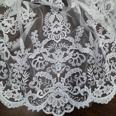 Corded & Beaded Bridal Lace Fabric Embroidered on 100% Polyester Net Mesh.  Sold the yard.  Lace Usa