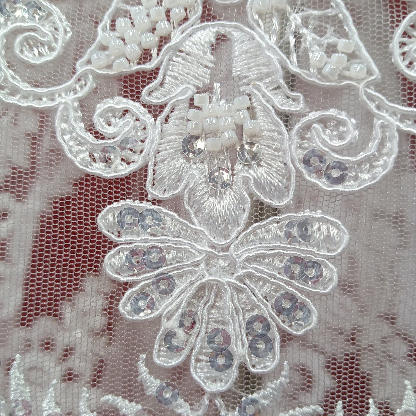 Corded & Beaded Bridal Lace Fabric Embroidered on 100% Polyester Net Mesh.  Sold the yard.  Lace Usa