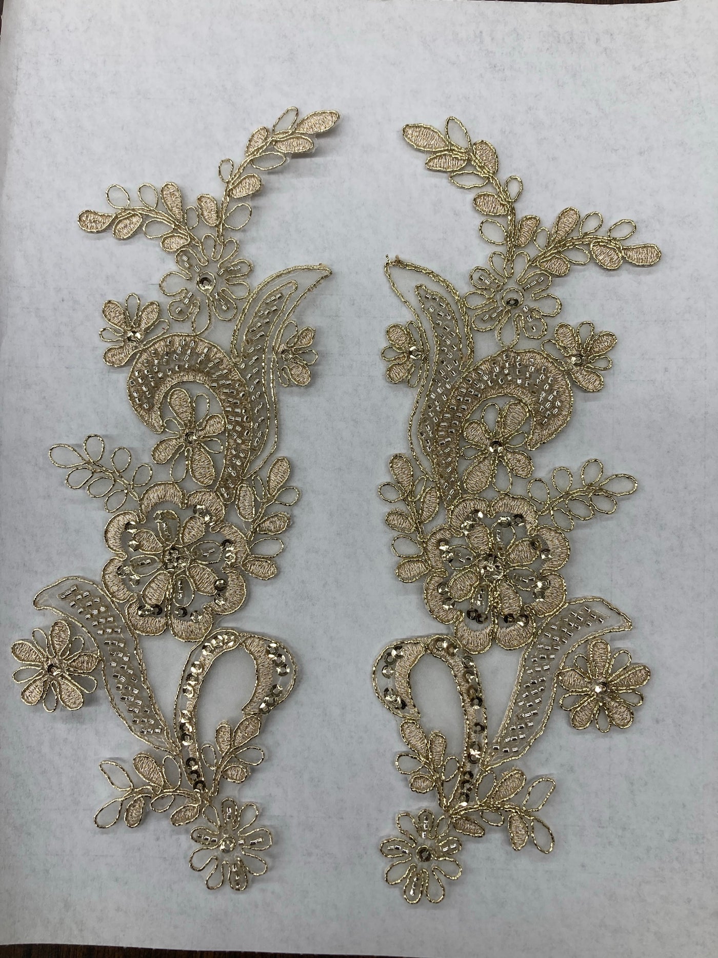 Beaded & Corded Floral Appliqué Lace Embroidered on 100% Polyester Organza or Net Mesh. This can be applied to Theatrical dance ballroom costumes, bridal dresses, bridal headbands endless possibilities.  Sold By Pair  Lace Usa