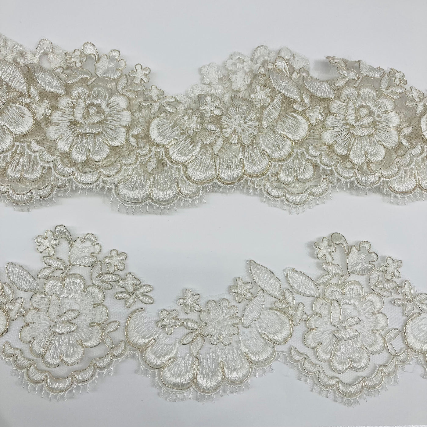 Corded Ivory with Silver Trimming Embroidered on 100% Polyester Net Mesh. Lace Usa
