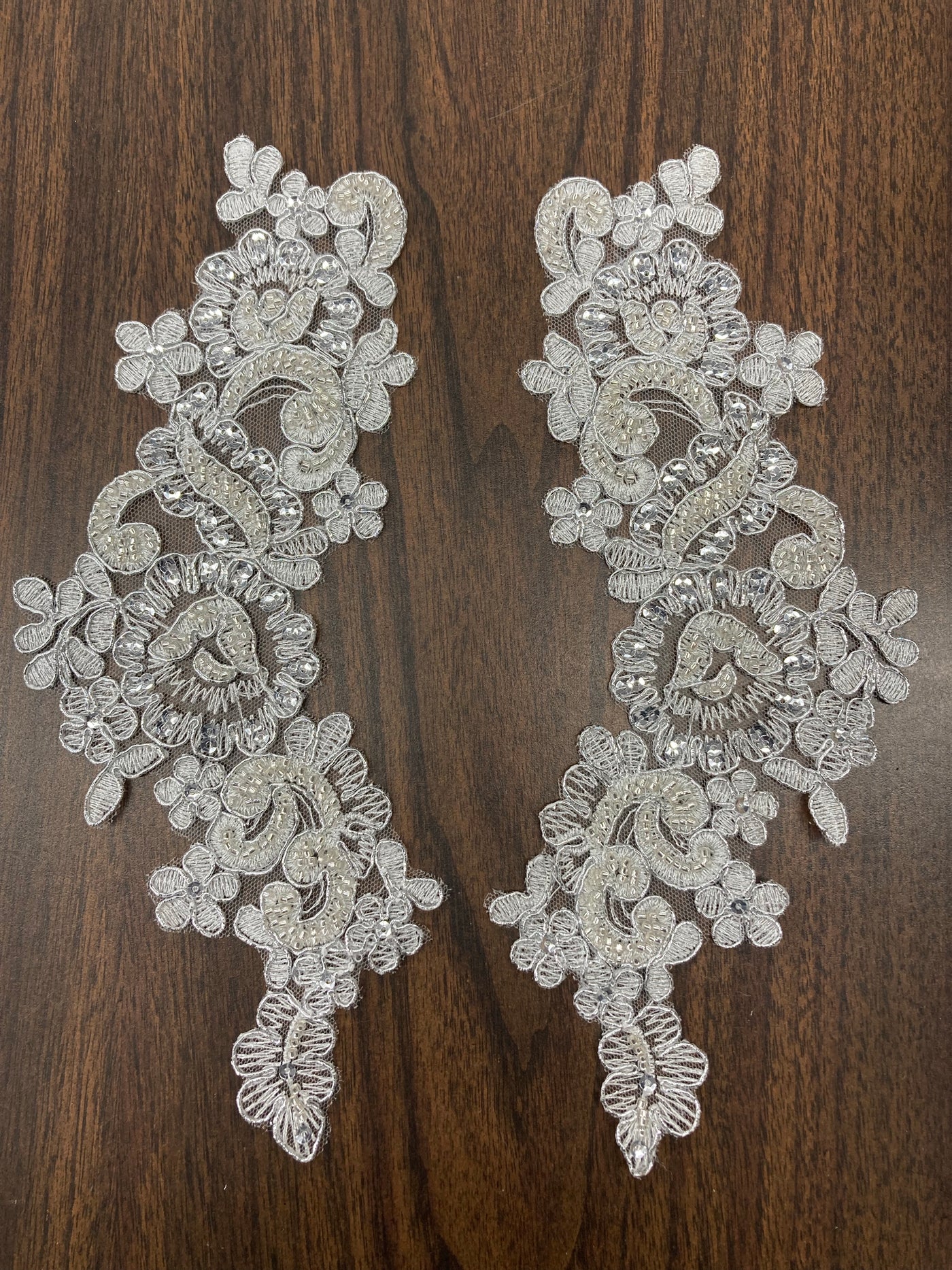 Beaded & Corded Floral Appliqué Lace Embroidered on 100% Polyester Organza or Net Mesh. This can be applied to Theatrical dance ballroom costumes, bridal dresses, bridal headbands endless possibilities.  Sold By Pair.  Lace Usa  Sold in a set of 2.