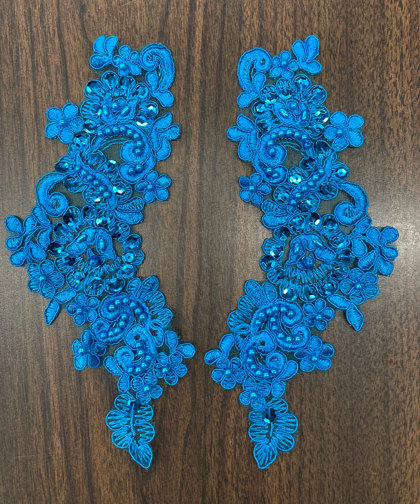 Beaded & Corded Floral Appliqué Lace Embroidered on 100% Polyester Organza or Net Mesh. This can be applied to Theatrical dance ballroom costumes, bridal dresses, bridal headbands endless possibilities.  Sold By Pair.  Lace Usa  Sold in a set of 2.