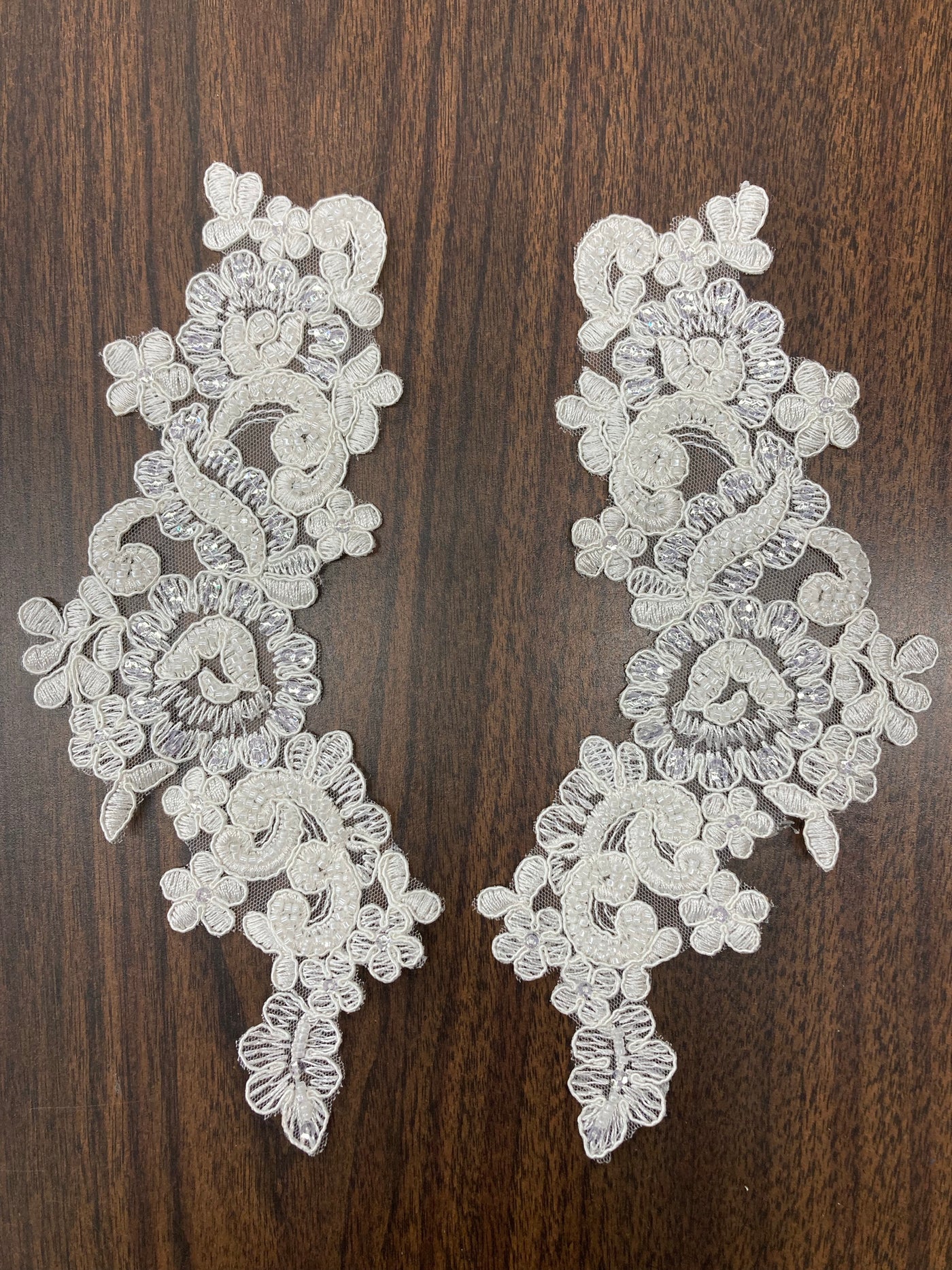 Beaded & Corded Floral Appliqué Lace Embroidered on 100% Polyester Organza or Net Mesh. This can be applied to Theatrical dance ballroom costumes, bridal dresses, bridal headbands endless possibilities.  Sold By Pair.  Lace Usa  Sold in a set of 2.