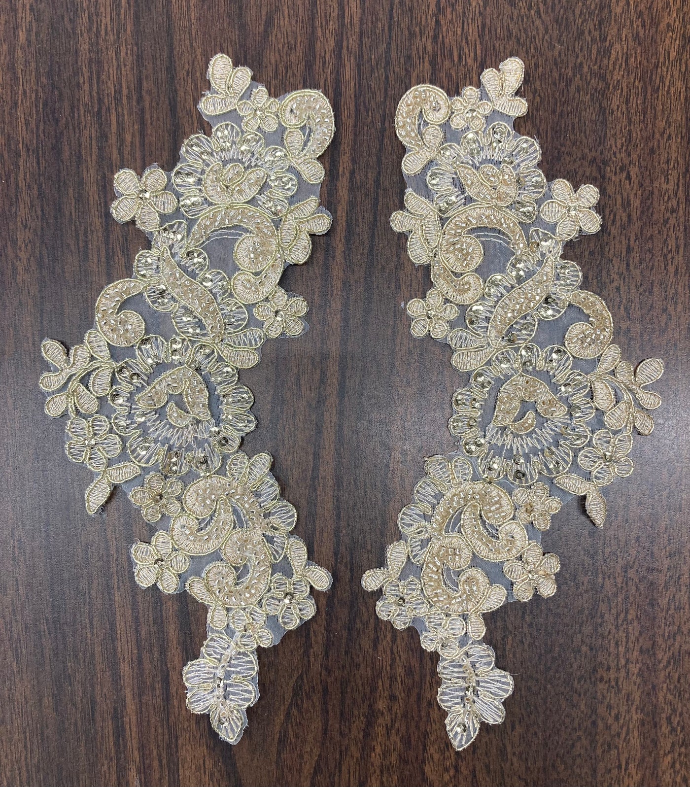 Beaded & Corded Floral Appliqué Lace Embroidered on 100% Polyester Organza or Net Mesh. This can be applied to Theatrical dance ballroom costumes, bridal dresses, bridal headbands endless possibilities.  Sold By Pair.  Lace Usa  Sold in a set of 2.