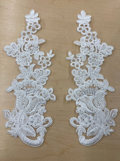Beaded & Corded Floral Ivory Appliqué Lace Embroidered on 100% Polyester Mesh Net. This can be applied to lyrical dance ballroom costumes, bridal dresses, bridal headbands endless possibilities.  Sold By Pair  Lace Usa