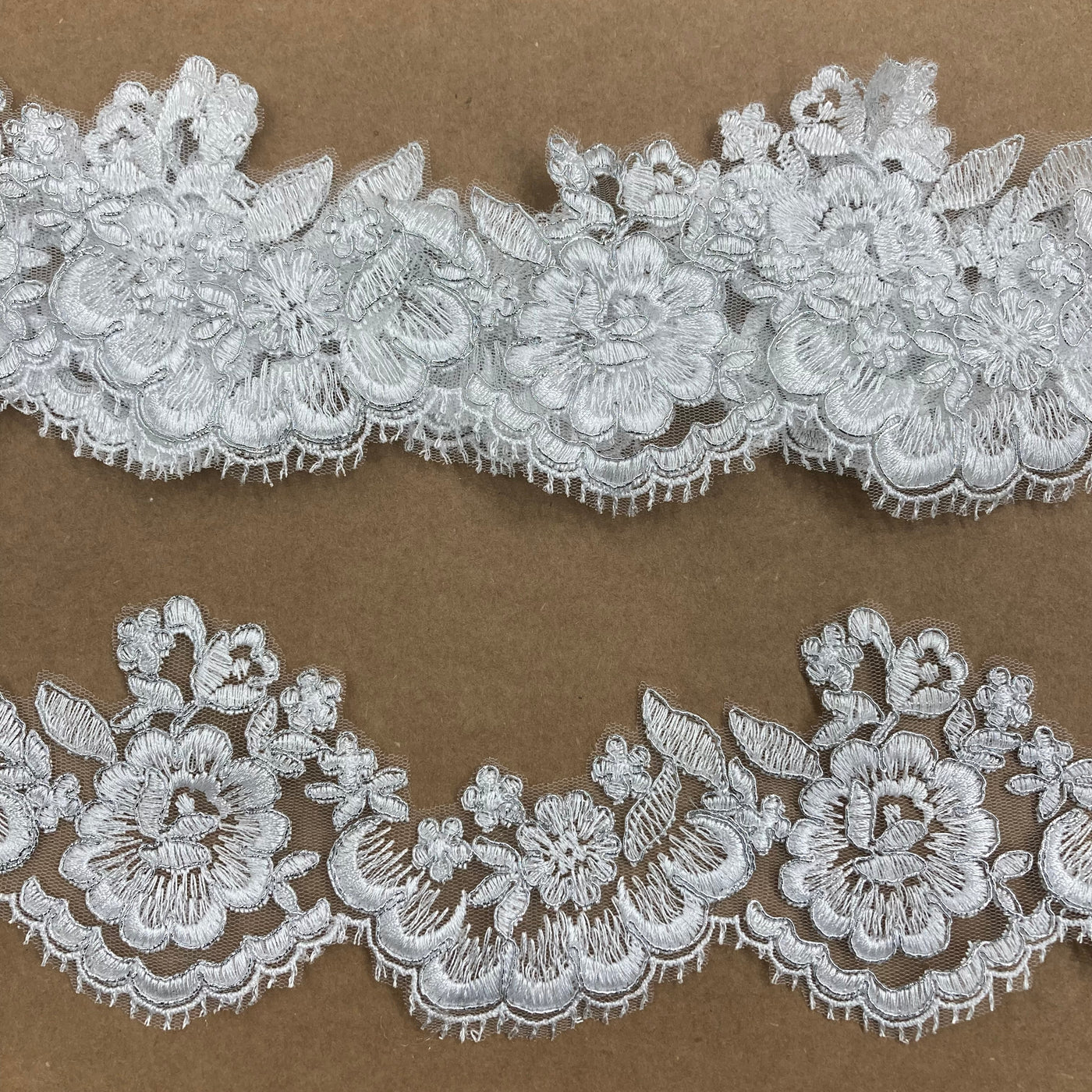 Corded White with Silver Trimming Embroidered on 100% Polyester Net Mesh. Lace Usa