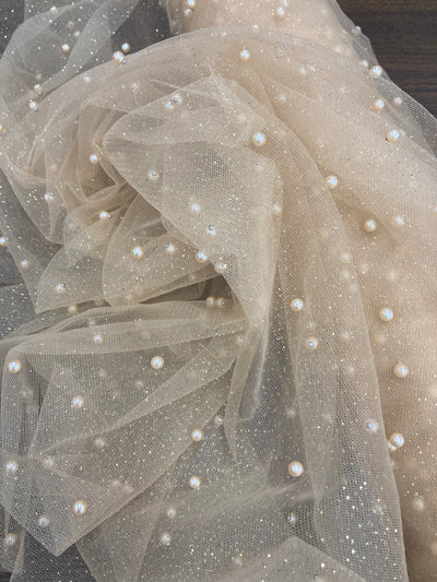 Glitter Mesh Net With Scattered Pearl , 2-Way Stretch, sold by the yard. 100% Polyester 60" wide. This mesh fabric is a 2-way stretch on the width. Pearls are scattered across the mesh.  Sold by the yard, 1-quantity equals to 1-yard.  If you order more than 1-yard, it will be ship in one continuous length.    Lace Usa