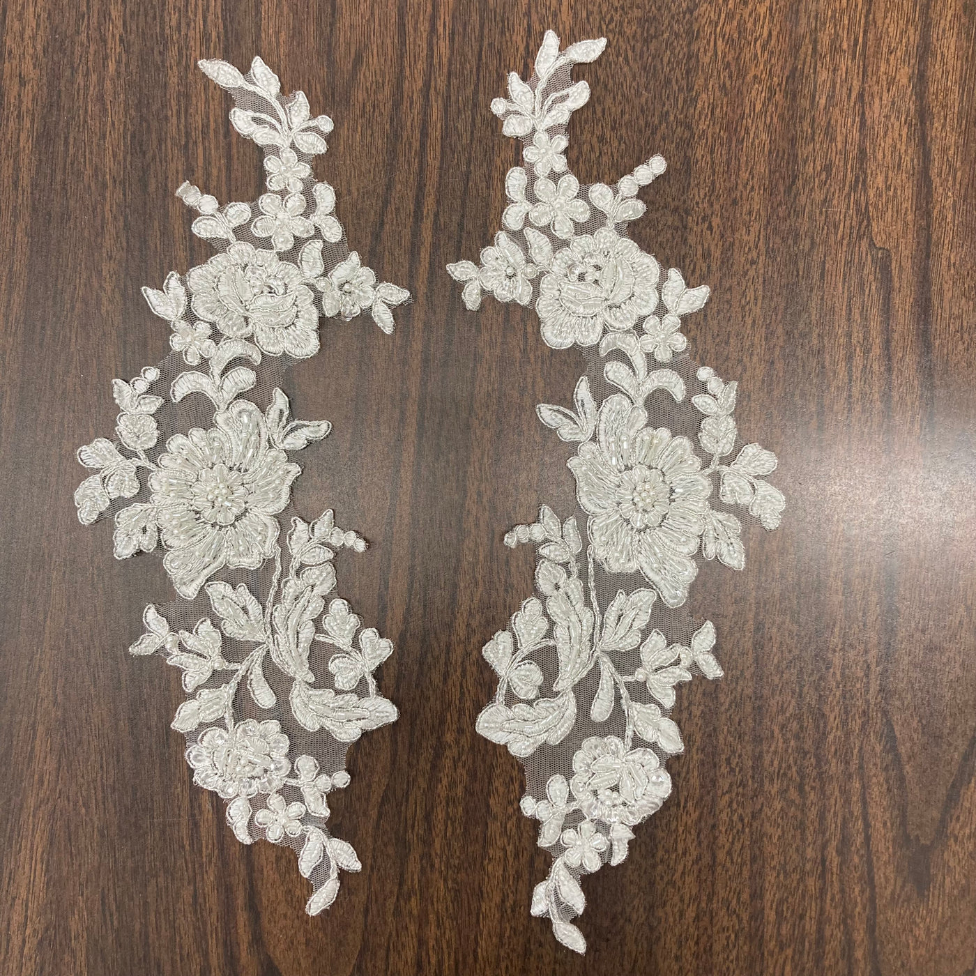 Beaded & Corded Floral Appliqué Lace Embroidered on 100% Polyester Organza or Net Mesh. This can be applied to Theatrical dance ballroom costumes, bridal dresses, bridal headbands endless possibilities.  Sold By Pair.  Lace Usa