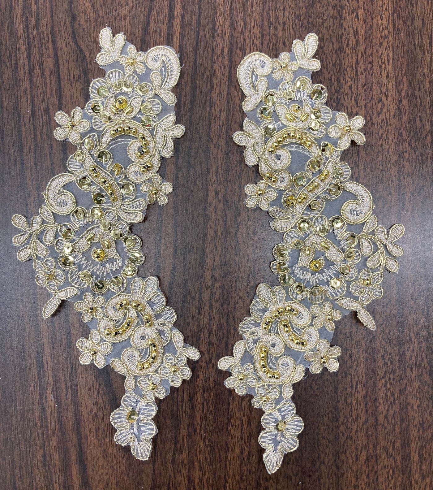 Beaded & Corded Floral Appliqué Lace Embroidered on 100% Polyester Organza or Net Mesh. This can be applied to Theatrical dance ballroom costumes, bridal dresses, bridal headbands endless possibilities.  Sold By Pair.  Lace Usa  Sold in a set of 2.