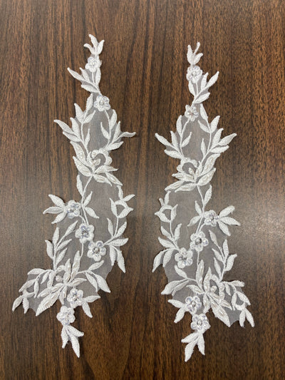 White Beaded Floral Applique Lace on 100% Polyester Organza Sold by the Pair. This can be allied to theatrical, dance, ballroom, costumes, bridal dresses, bridal headbands endless possibilities.  Lace Usa