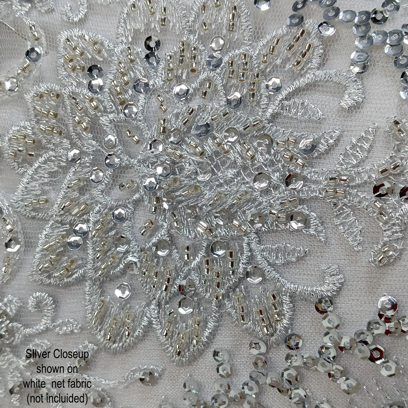 Embroidered & Heavily Beaded with Beads & sequin on Net Mesh Fabric.  Sold by the yard.  Lace Usa